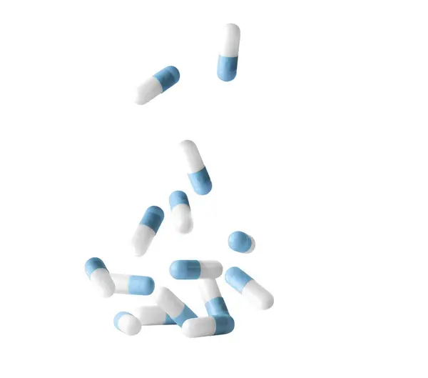 白い背景に隔離された青い薬の丸薬のカプセル落ちる 抗生物質について — ストック写真