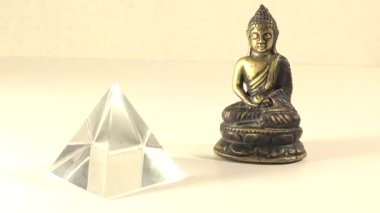 Golden Buddha Statue and a Crystal Pyramid