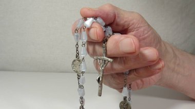 Bible and Hands on White Background