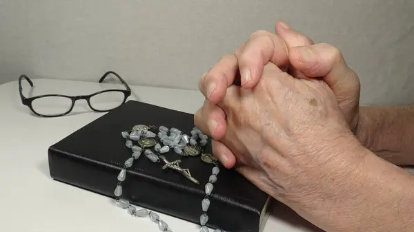 Bible and Hands on White Background