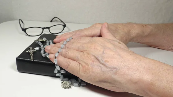 Bible and Hands on White Background