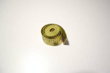 Yellow Measuring Tape on White Background, CM, Inches