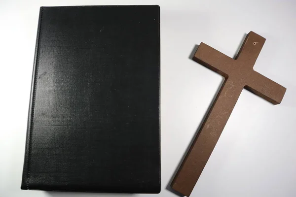 stock image Bible and Christian Brown Wooden Cross on a White Background