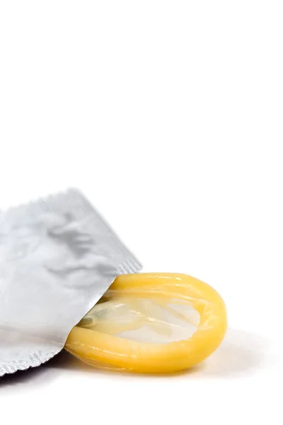 Yellow Condom Vertical Plane White Background — Stock Photo, Image