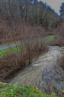 Normandy, France, Europe : Exterior photo view water floods due to climate change in fields creating damage disaster in agriculture environement clipart