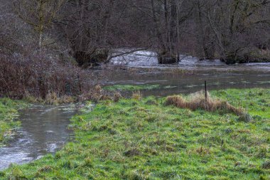 Normandy, France, Europe : Exterior photo view water floods due to climate change in fields creating damage disaster in agriculture environement clipart