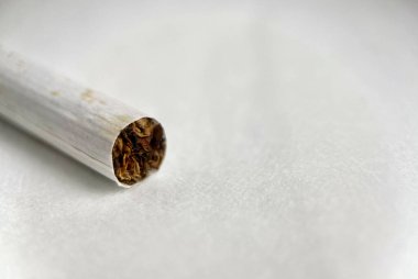 Close up cigarette object photography isolated on copy spaced white background. clipart