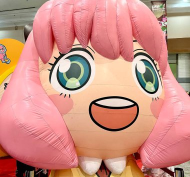 Jakarta, Indonesia - May 5th, 2024 -  Cute Anya Forger balloon character from Spy x family. Anime festival events at AFA Anime Festival Asia 2024 in JCC Jakarta Convention Centre. clipart