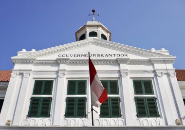 Jakarta, Indonesia - July 31th, 2024 - Museum Fatahillah kota tua building exterior from below view isolated on horizontal blue sky background. clipart