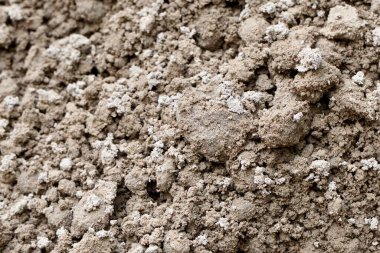 Yatay tam çerçeve üzerinde izole edilmiş düz olmayan kahverengi yapı kum yığını dokusu.