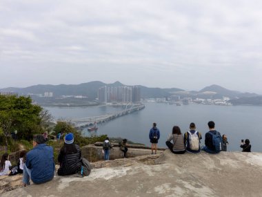 2023 Jan 26,Hong Kong.The Tseung Kwan O Cross Bay Bridge can be seen from the Devil's Peak Battery Devil's Peak Battery is a former fort in Hong Kong, located in Devil's Hill, Yau To.