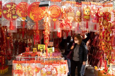 2023 Jan 4,Hong Kong.To celebrate the coming Chinese New Year, outdoor shopping stalls place red goods representing luck for sale.