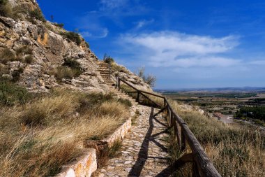 view of a beautiful scenery with a cliff and a mountain