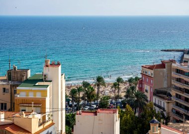 October 2022 - Alicante, Spain - Aerial view of the Spanish city of Alicante on the shores of the turquoise Mediterranean Sea on a sunny day