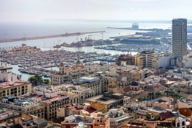 October 2022 - Alicante, Spain - Aerial view of the Spanish city of Alicante on the shores of the turquoise Mediterranean Sea on a sunny day
