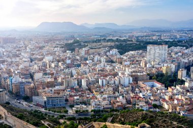 October 2022 - Alicante, Spain - Aerial view of the Spanish city of Alicante on the shores of the turquoise Mediterranean Sea on a sunny day