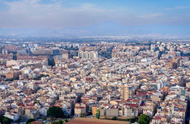 October 2022 - Alicante, Spain - Aerial view of the Spanish city of Alicante on the shores of the turquoise Mediterranean Sea on a sunny day