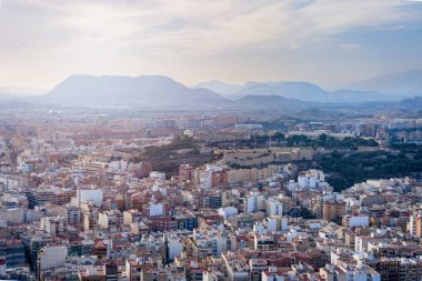 October 2022 - Alicante, Spain - Aerial view of the Spanish city of Alicante on the shores of the turquoise Mediterranean Sea on a sunny day