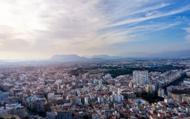October 2022 - Alicante, Spain - Aerial view of the Spanish city of Alicante on the shores of the turquoise Mediterranean Sea on a sunny day