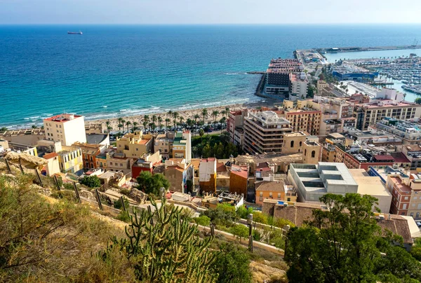 October 2022 - Alicante, Spain - Aerial view of the Spanish city of Alicante on the shores of the turquoise Mediterranean Sea on a sunny day