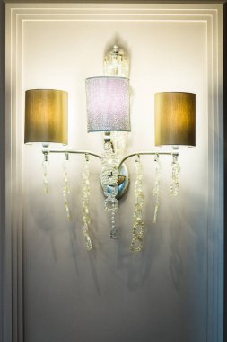 Very beautiful chandelier with glass pendants of different colors in the interior