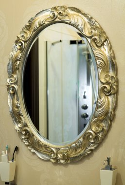 Reflection of a part of the interior in a beautiful mirror