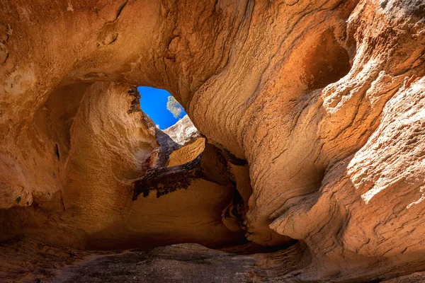 Mountain cave with orange stone texture