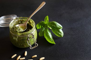 Homemade basil pesto (Genoese pesto). Mediterranean dish.Vegetarian food. Directly above.