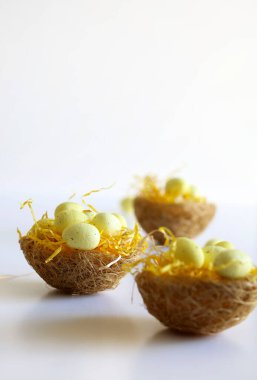 Concept of Easter holiday. Easter eggs in baskets isolated on white background. Copy space.