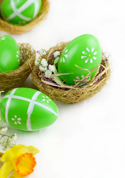 Concept of Easter holiday. Easter eggs in baskets isolated on white background. Copy space. Directly above.