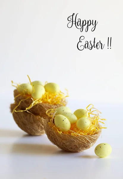 Concept of Easter holiday. Easter eggs in baskets isolated on white background. Copy space.