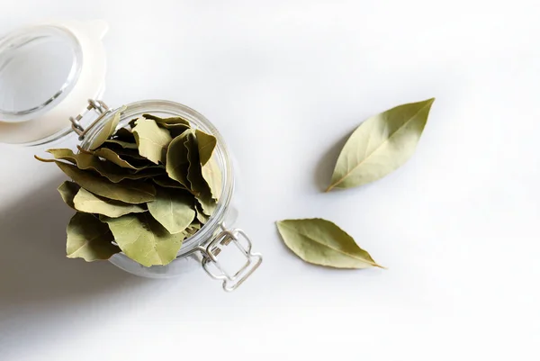 Dried bay leaves pile isolated on white background. Bay laurel leaves. Copy space. Directly above.