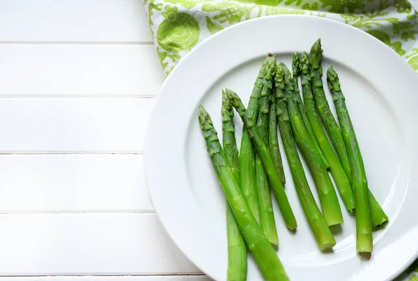 stock image Boiled asparagus isolated on white background. Directly above.