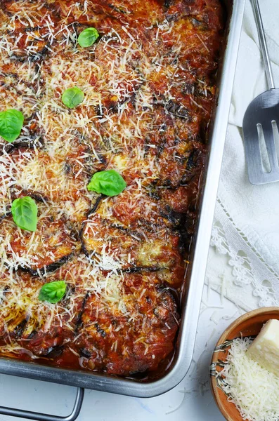 stock image Concept of Italian food. Baked eggplant with cheese and tomato sauce on white background. Parmigiana melanzane. Directly above.