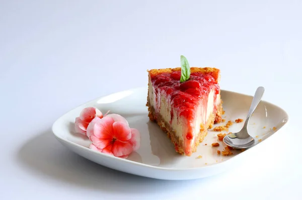 stock image Homemade sweet concept. Slice of strawberry cheesecake on white background. Close-up, copy space.