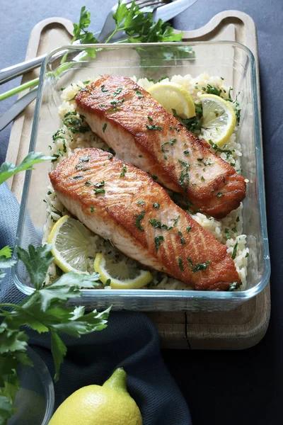 Baked salmon fillet with lemon rice. Healthy food. Homemade cooking. Overhead view.