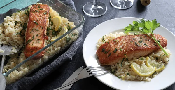 Baked salmon fillet with lemon rice. Healthy food. Homemade cooking. Overhead view.