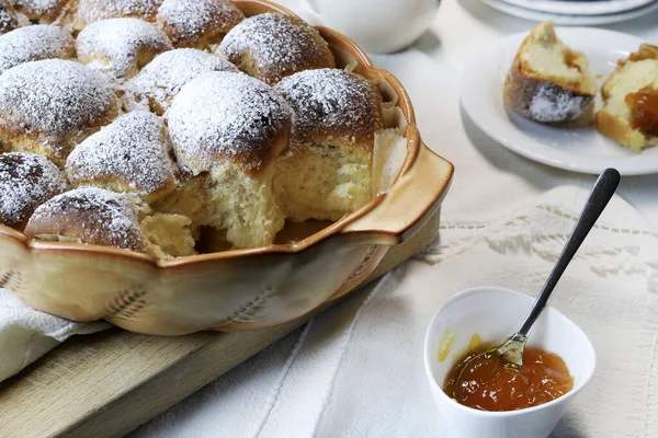 stock image Homemade Austrian Buchteln filled with apricot jam isolated on white background. Sweet buns. Yeast dough cakes. Overhead view.