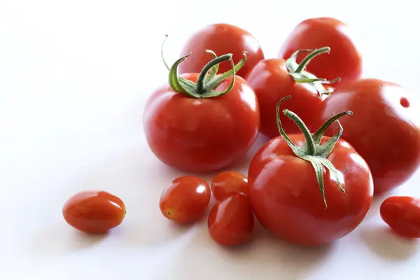 Stock image A group of fresh tomatoes isolated on white background. Healthy and vegetarian food. Copy space.