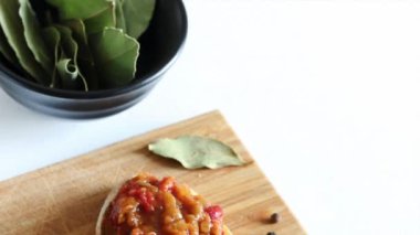 Zacusca - Romanian food. Slices of bread with vegetable spread, roasted eggplant, onions, tomato paste and roasted red peppers. Autumn and vegetarian food.