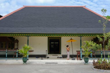 a small white and blue houses in an ancient house in a village