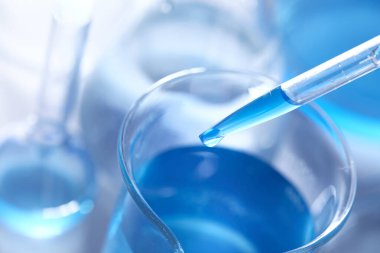 Science laboratory with beaker and dropper