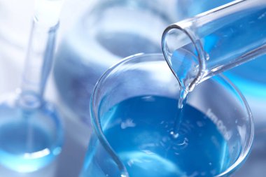 Science laboratory with beaker and dropper