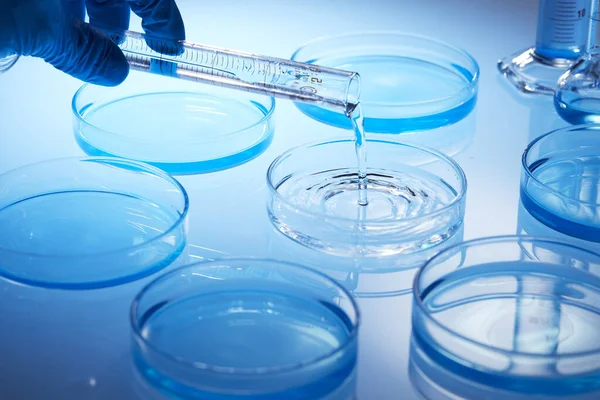 Science laboratory with beaker and dropper