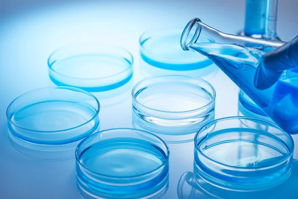 Science laboratory with beaker and dropper