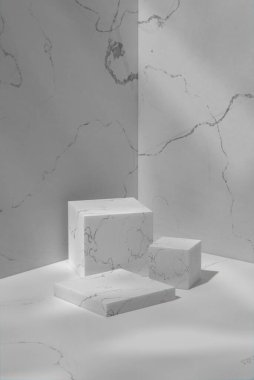 Gray tone marble wall and podium in a sunny room. 3d Render.