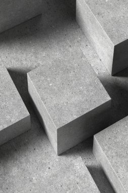 Çeşitli tasarım kullanımları için uygun bir beton kare podyum.