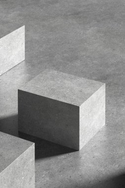 Çeşitli tasarım kullanımları için uygun bir beton kare podyum.