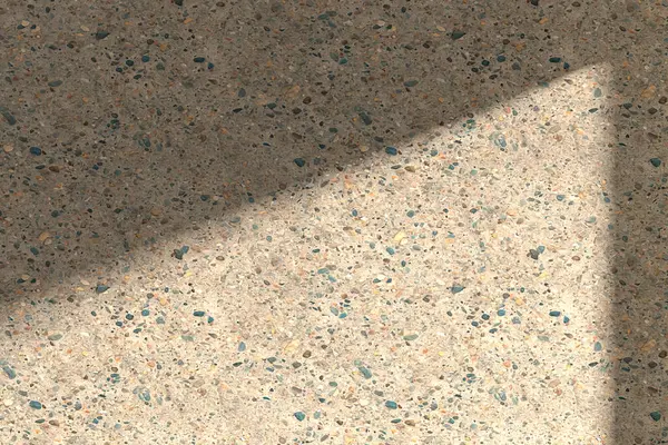 Güneş ışığından gelen doğal gölgeli beton desenli bir duvar çeşitli tasarımlarda kullanılabilen bir pencereden içeri giriyor..