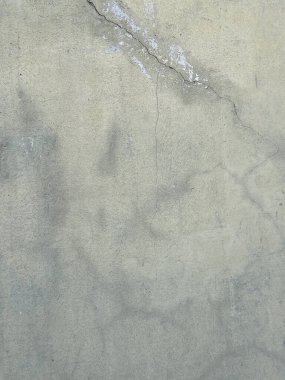 Soyut grunge gri arkaplan. Tasarım arka planı olarak kullanılabilecek zengin bir eski dokuya sahip bir duvar..